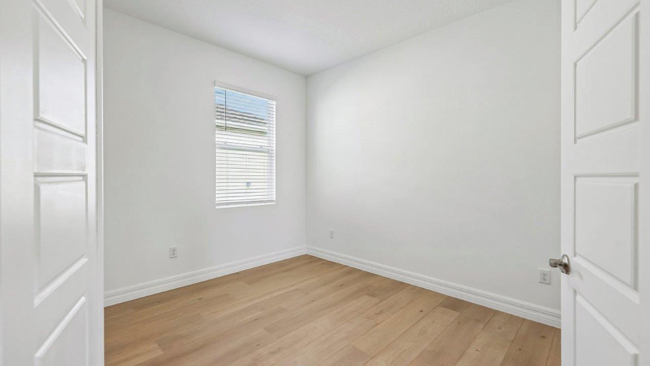 Flex room with double doors and Revwood flooring