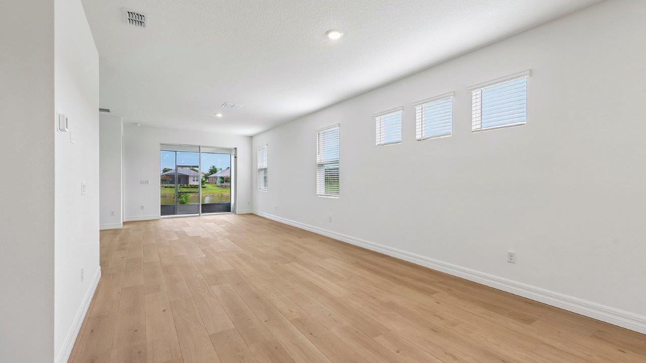 Living room with a lot of natural light and sliding door