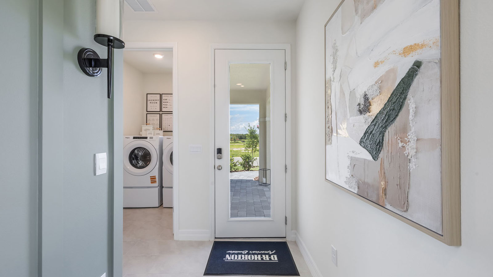 Entryway with view of the laundry room