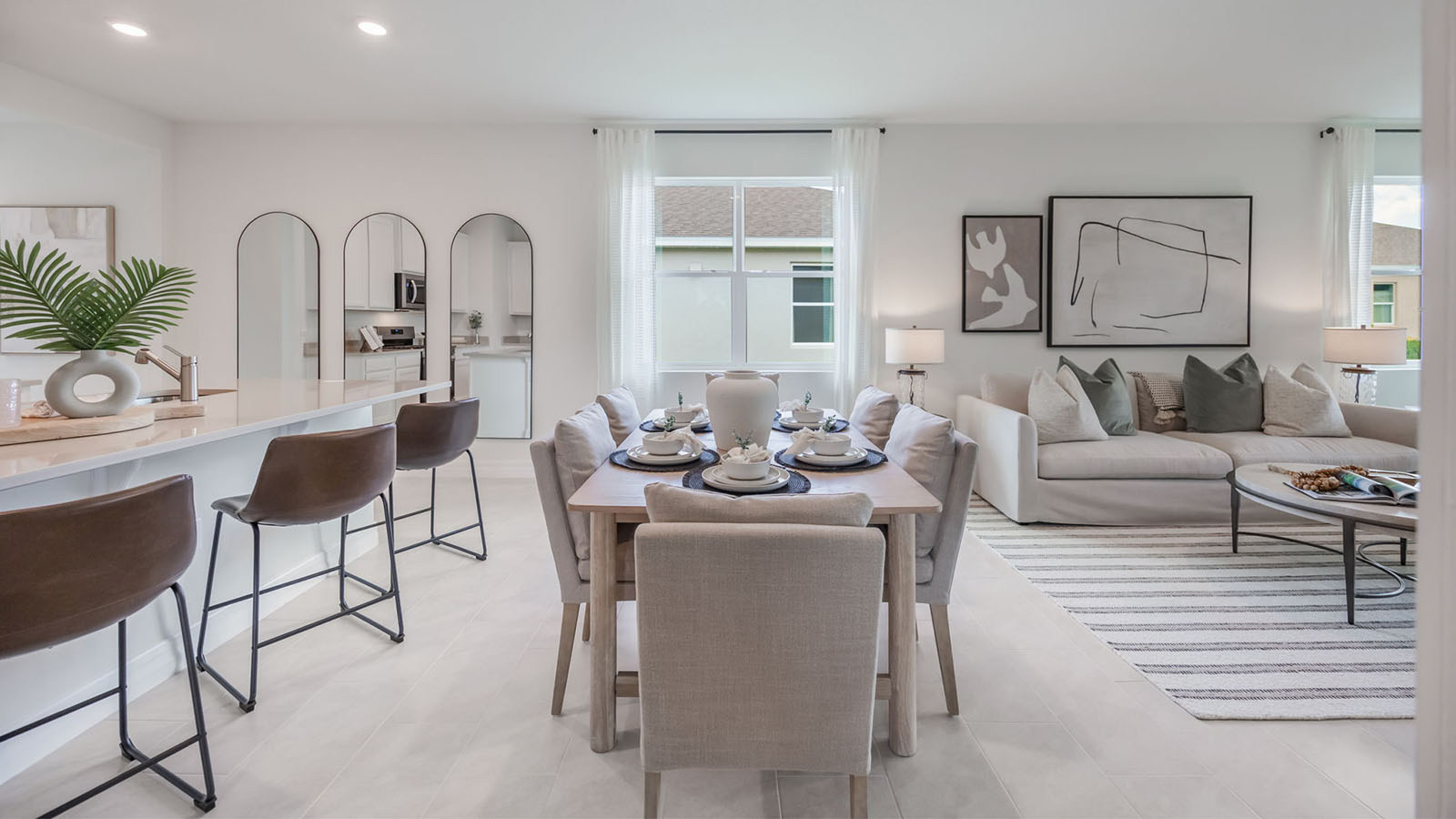 6 person dining table with view of kitchen and living room