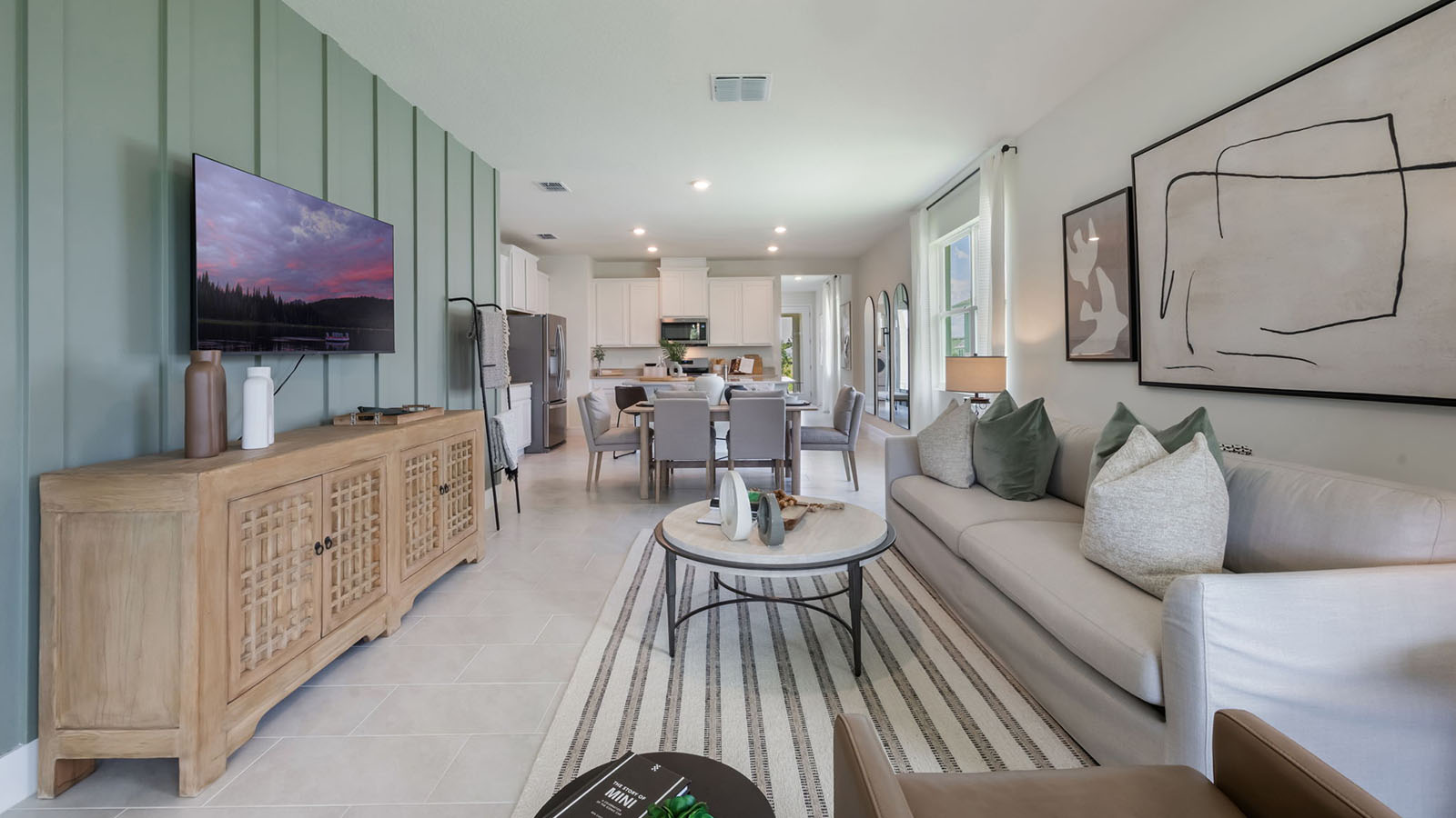 Open concept living room with view to the dining room and kitchen