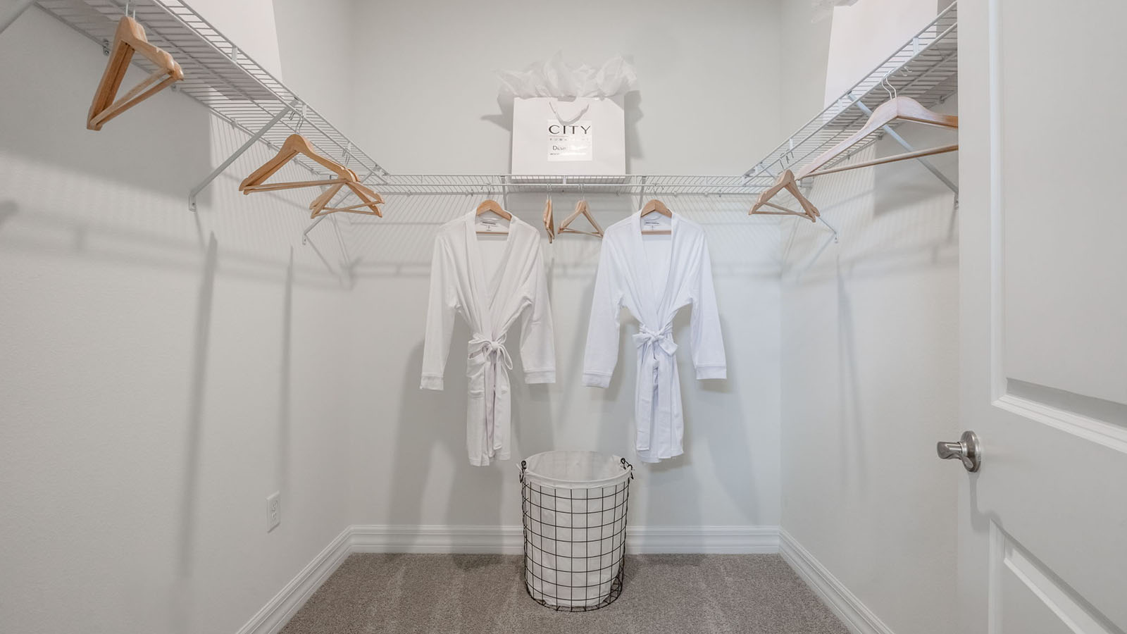 Primary bedroom walk-in closet