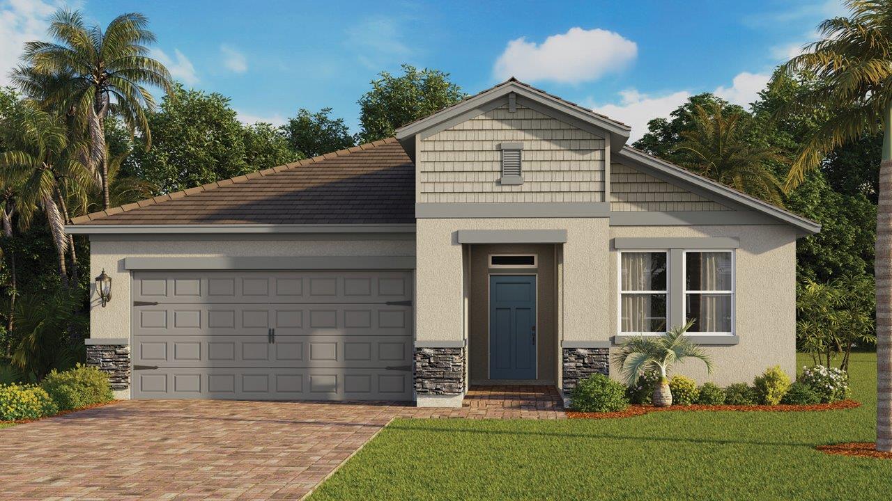 Single-family home with stone and paver driveway