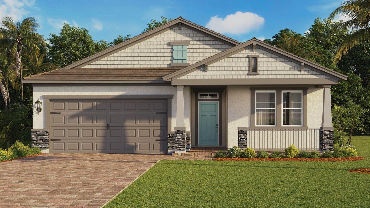 Single-family home with front porch, stone accents, and paver driveways