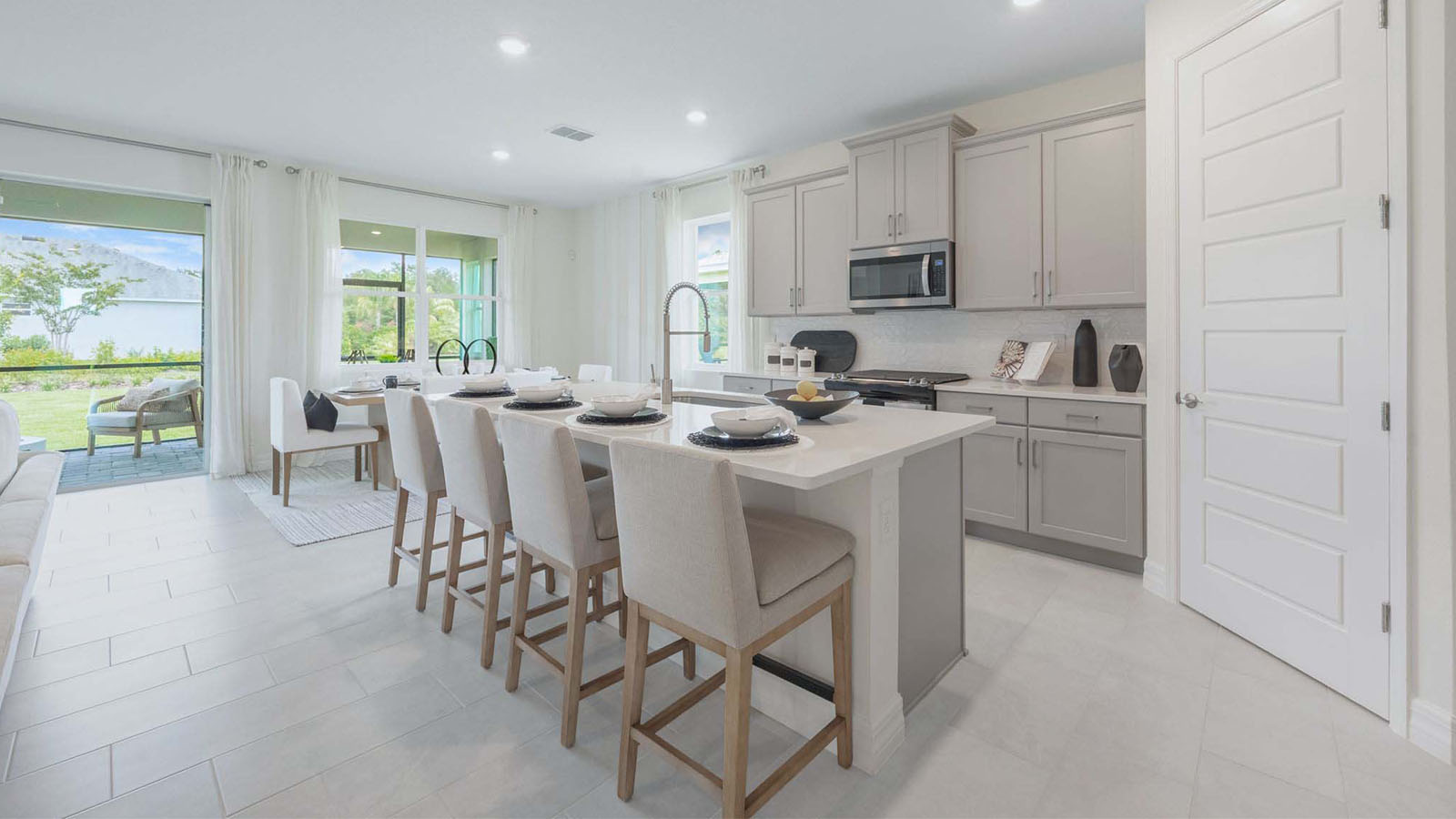 Kitchen and dining room with windows to the back porch