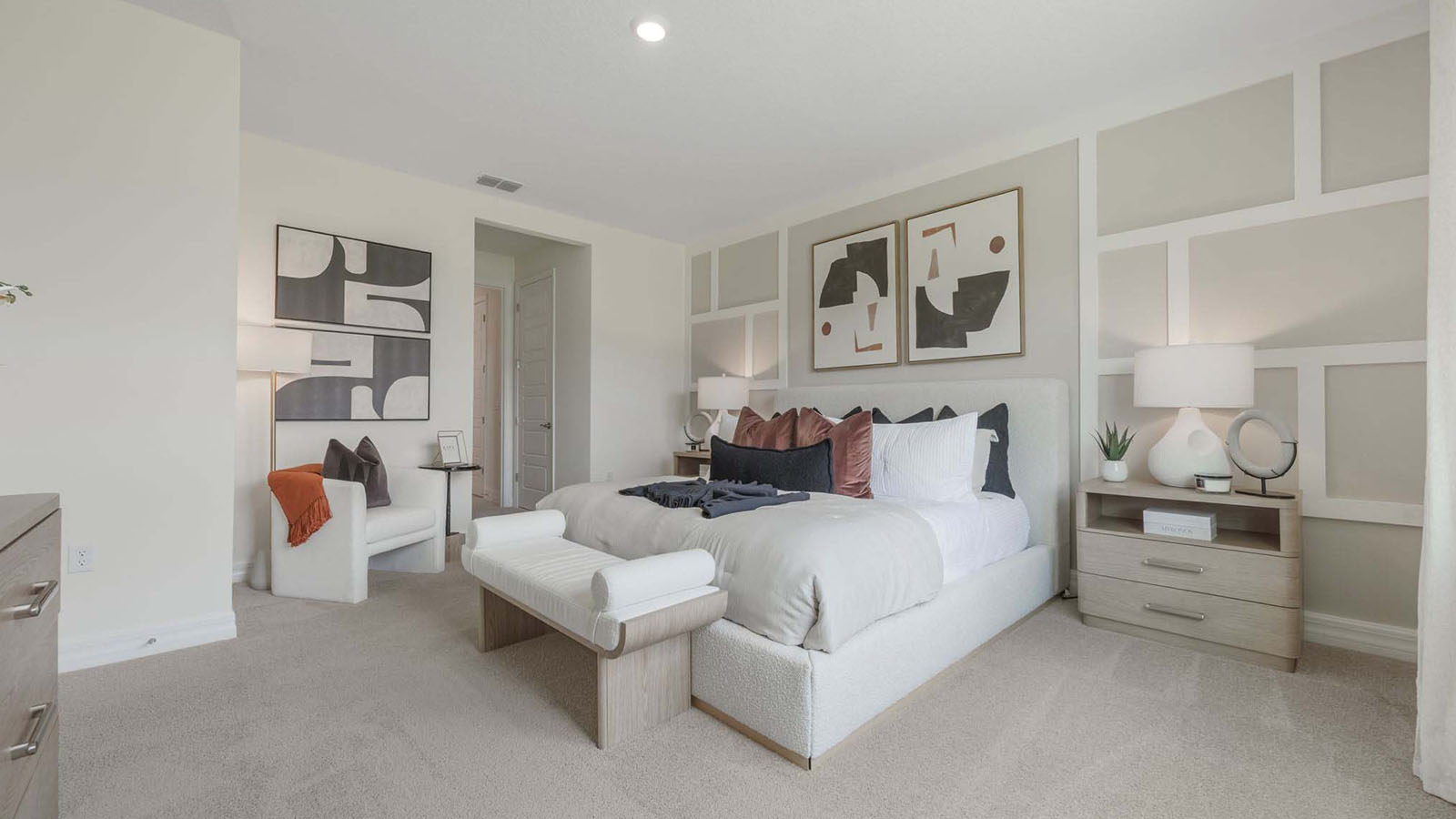 Primary bedroom with king size bed and ensuite bathroom