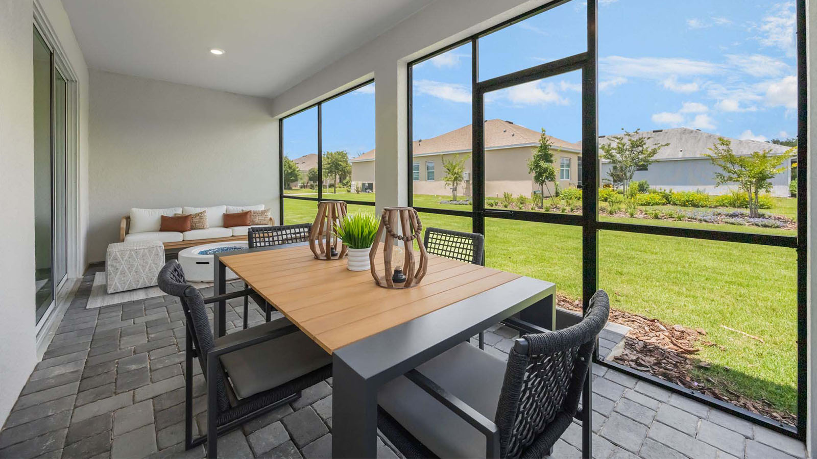 Screened in back porch with dining table