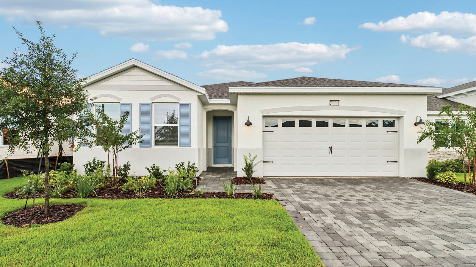 Single story home with two-car garage and stone accents
