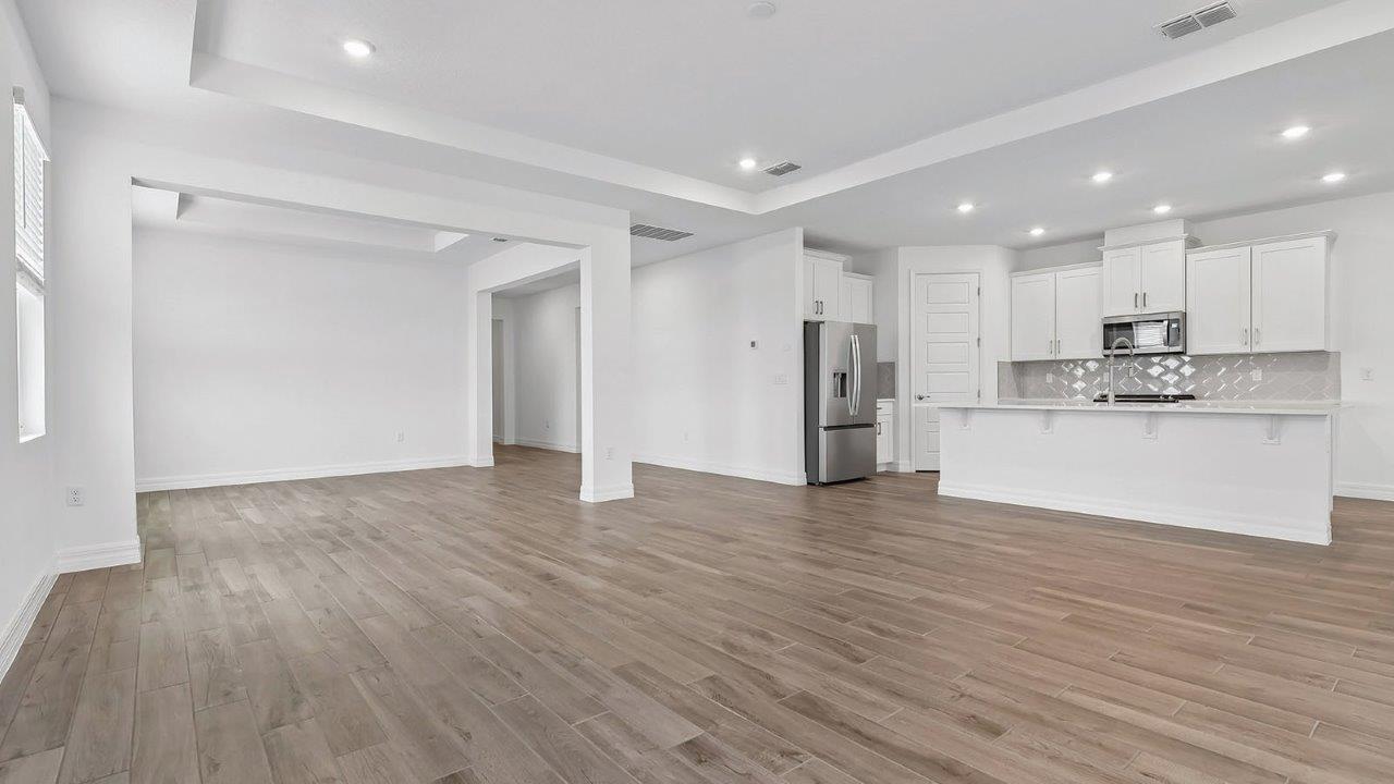 great room open concept view to dining and kitchen areas