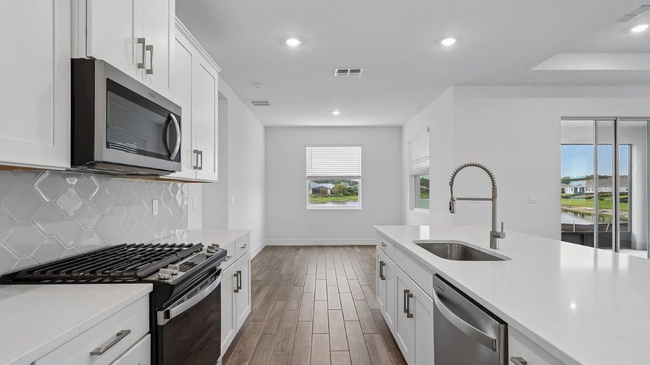 Kitchen with cafe and stainless steel appliances
