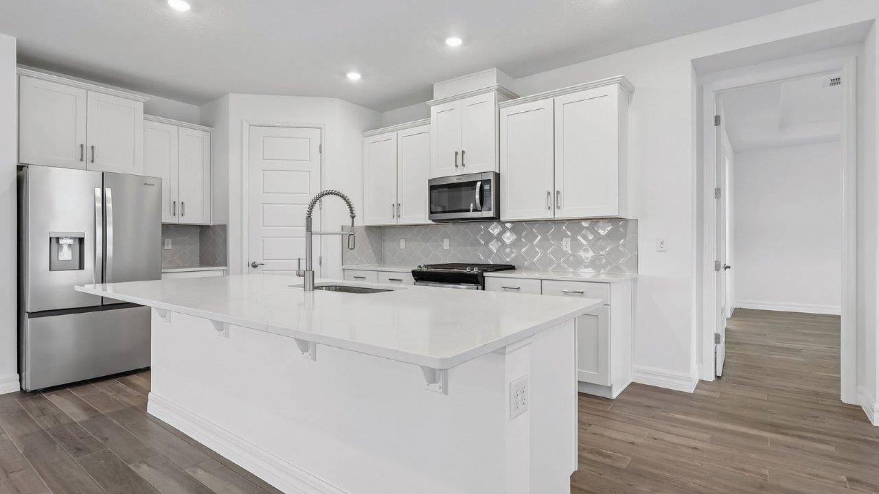 Kitchen with large island and stainless steel appliances