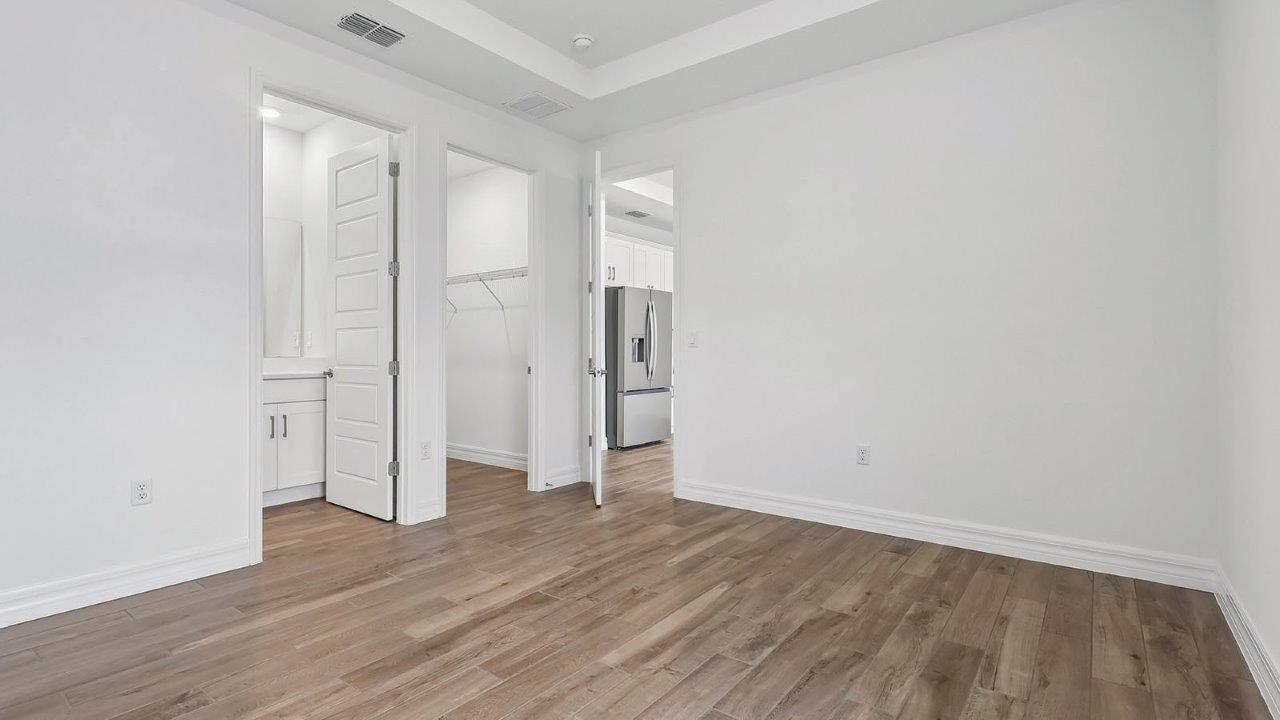 multi-gen suite bedroom with connecting living room and ensuite bathroom