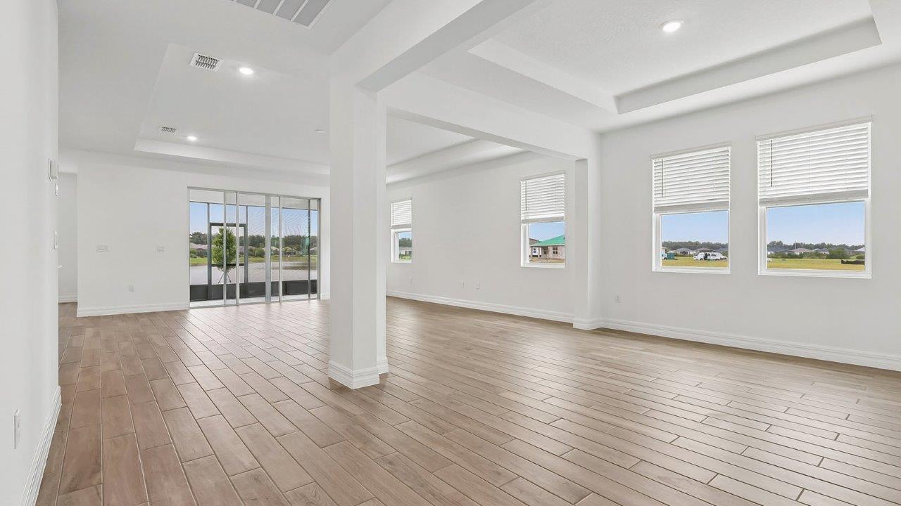 great room with designated dining area and sliding glass doors