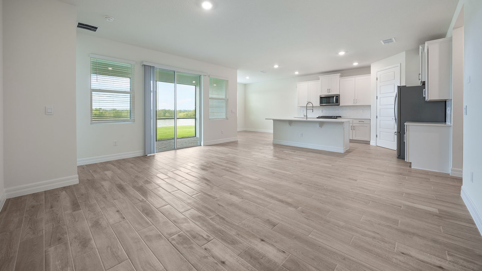 Living room with sliding glass door to enclosed patio