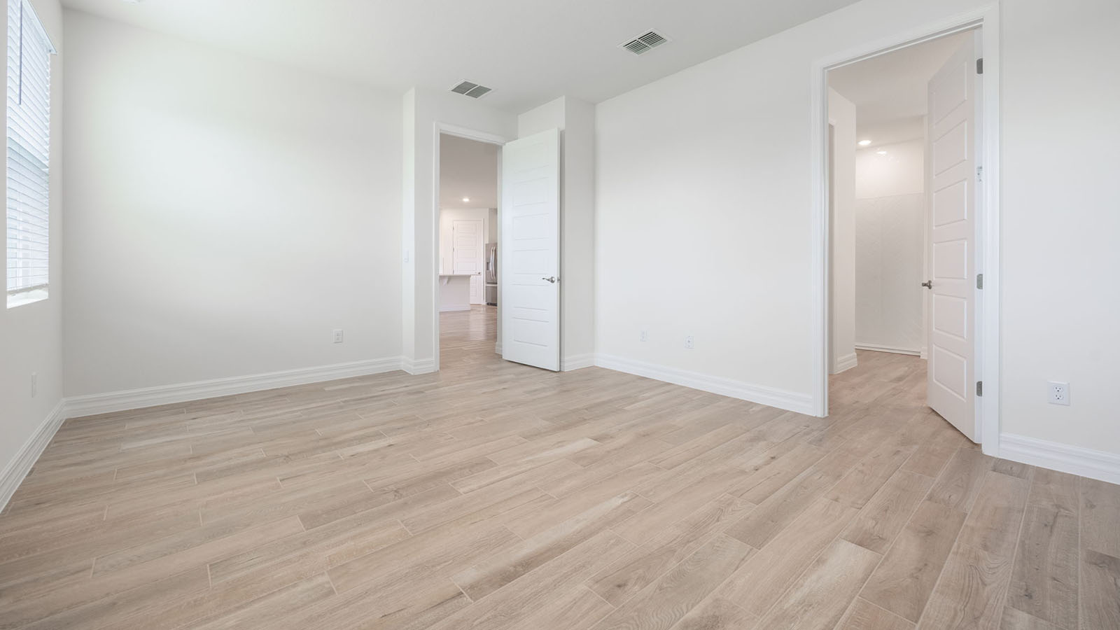 Primary bedroom with walk in closet