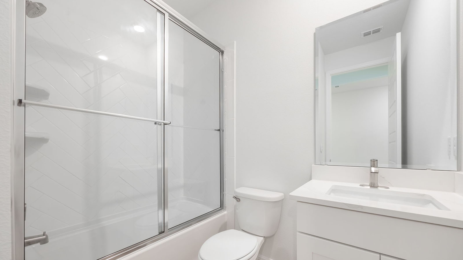 Guest bathroom with enclosed tub and shower combo