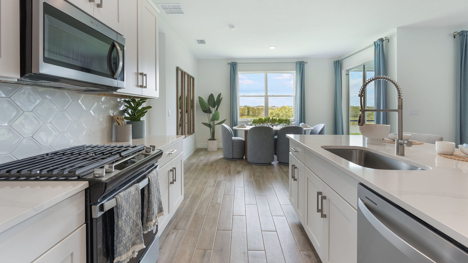 Spacious kitchen with gas stove and island sink