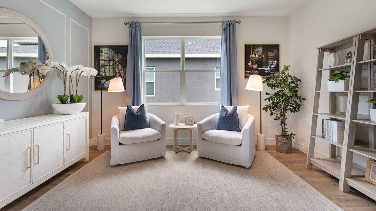 Flex room with seating and bookshelves