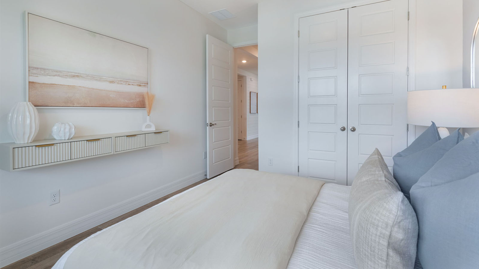 Guest bedroom with queen size bed and closet