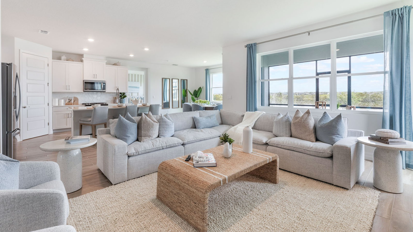 Spacious living room with view to kitchen and dining room