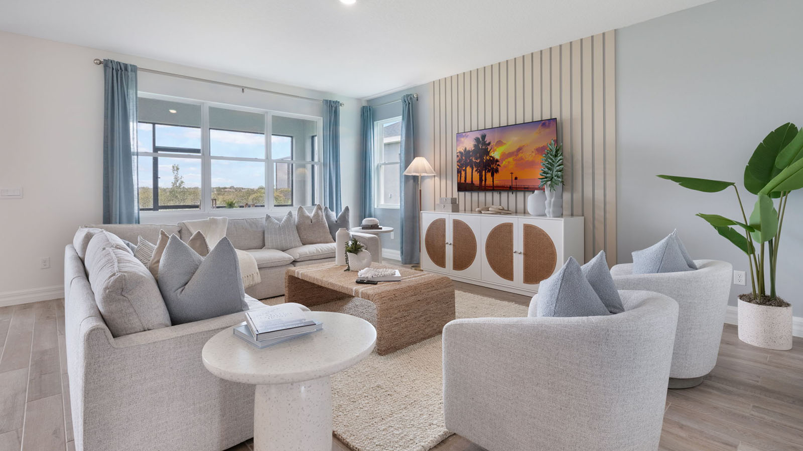 Living room with a window to the back yard and enclosed lanai