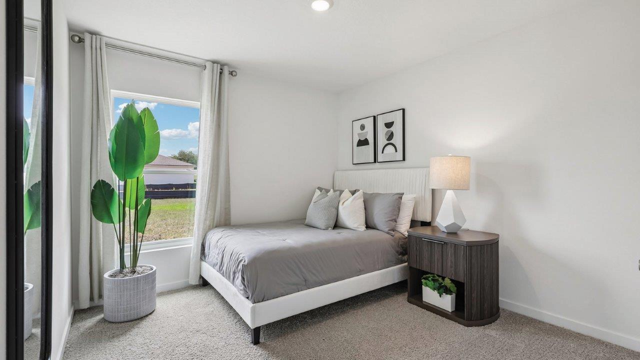 Guest room with full size bed and nightstand