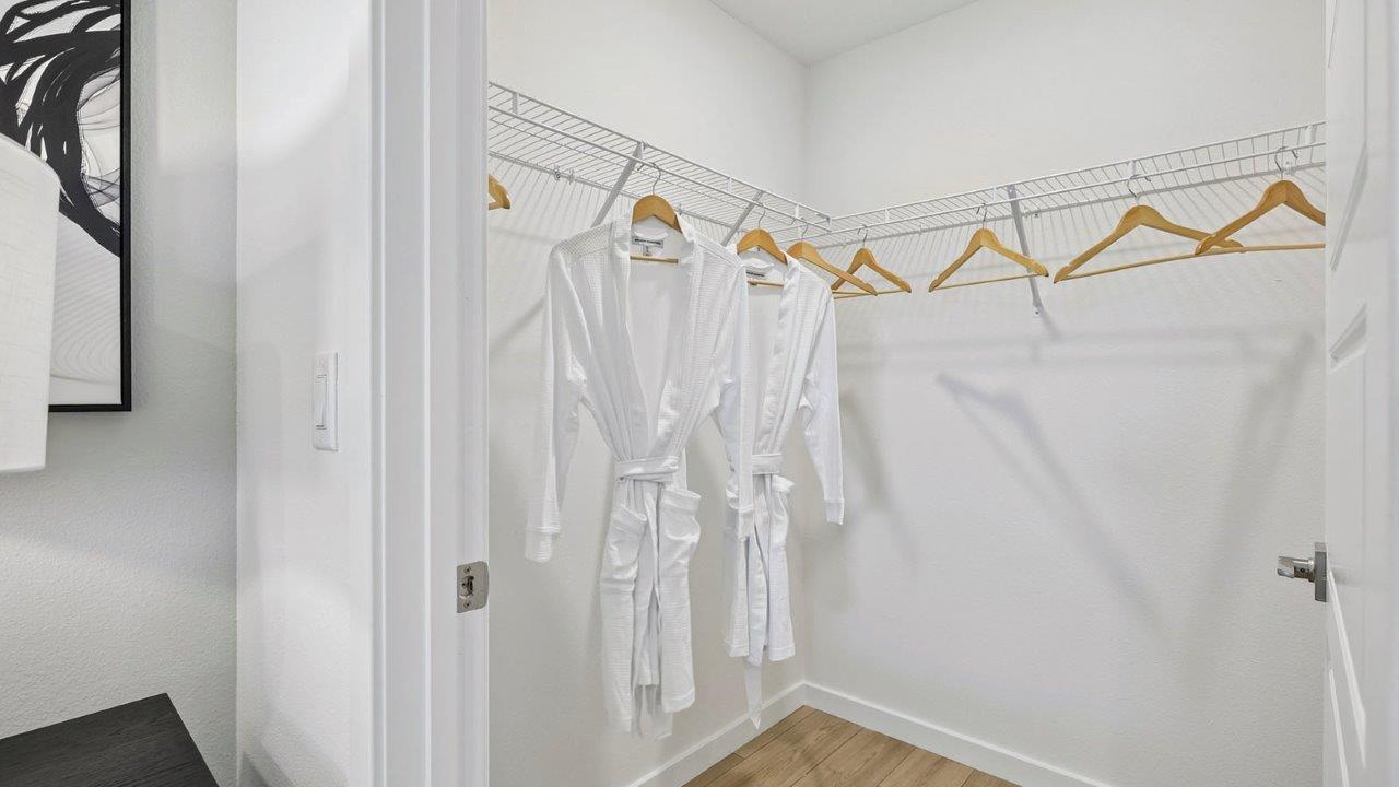 Primary bedroom walk in closet