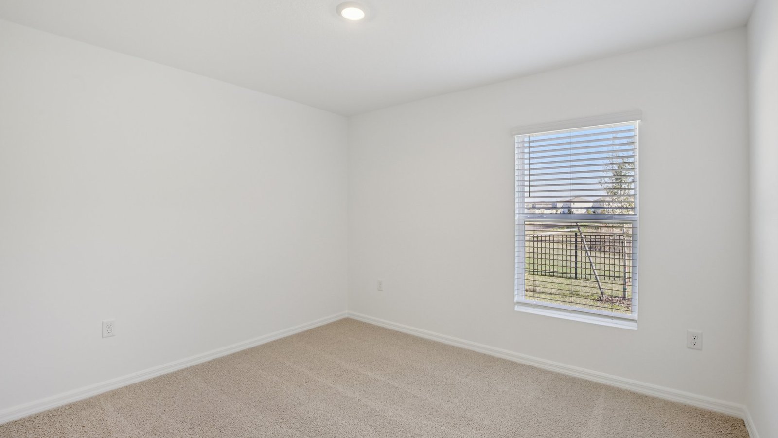 Spare bedroom for guests, with bed, dresser, and ample closet storage.