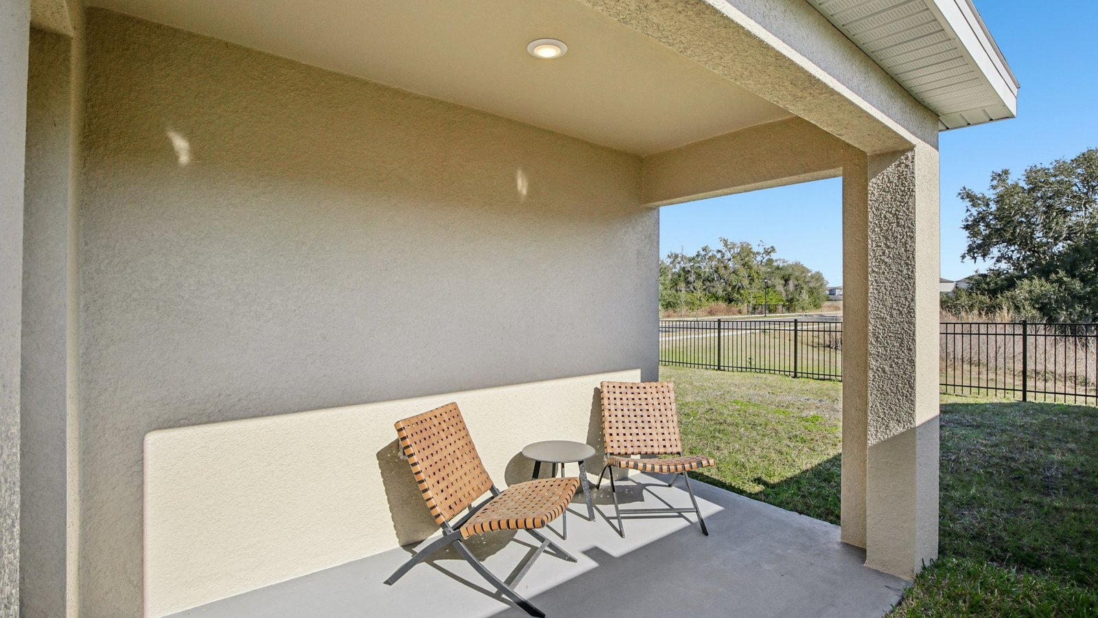 Home backyard with covered lanai, and room for entertaining.