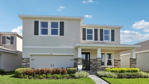Two-story new home with stucco, covered porch and 2 car garage.New construction land O Lakes.