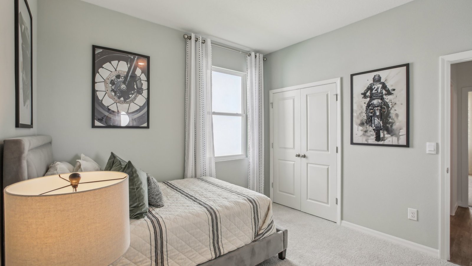 Guest bedroom with bed, nightstands and a roomy closet for storage.