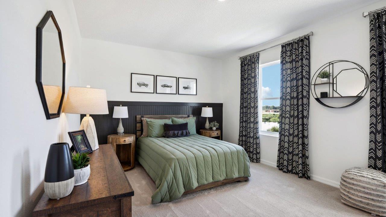 Guest bedroom with bed, nightstands, and a roomy closet for storage.