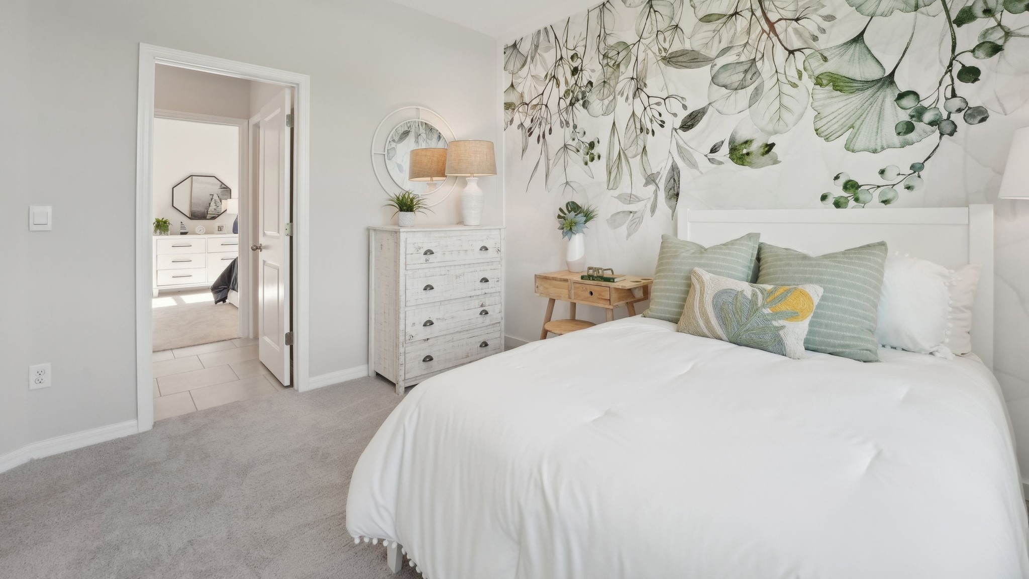 Guest bedroom with bed, nightstands, and a roomy closet for storage.