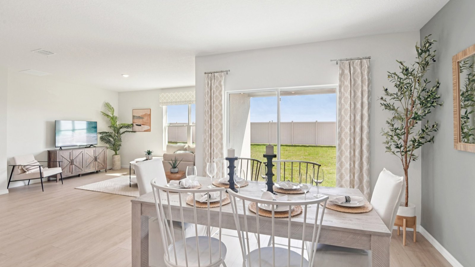 Dining room adjacent to the kitchen with table, chairs and LVP flooring.