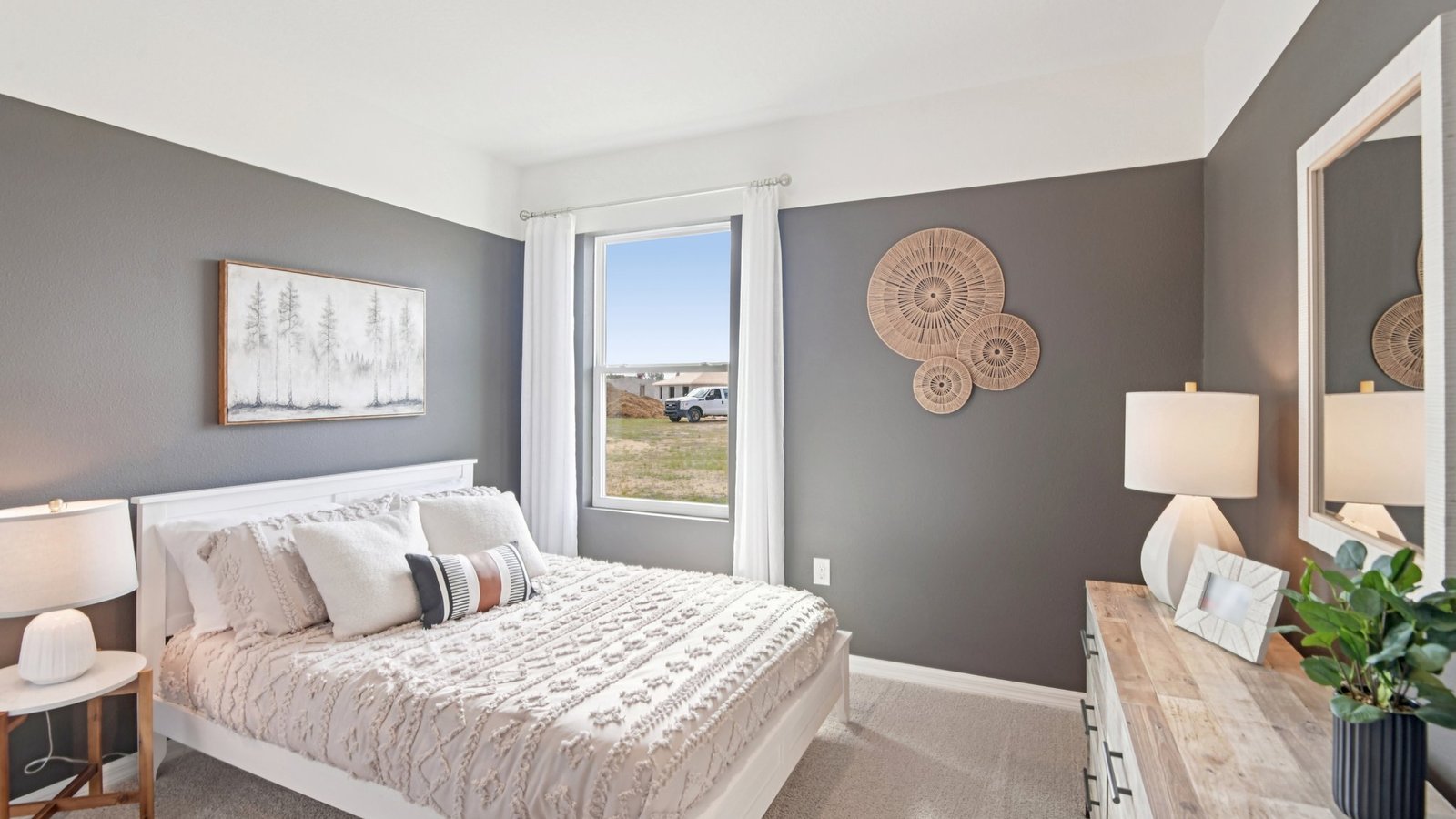 Guest bedroom with bed, nightstands and a roomy closet for storage.