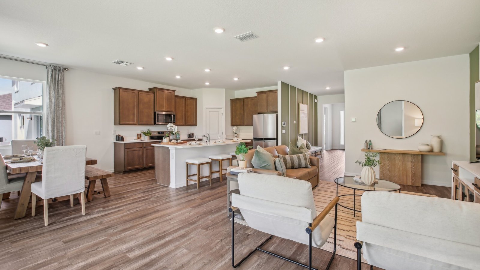 Dining room adjacent to the kitchen with table, chairs and tile flooring.