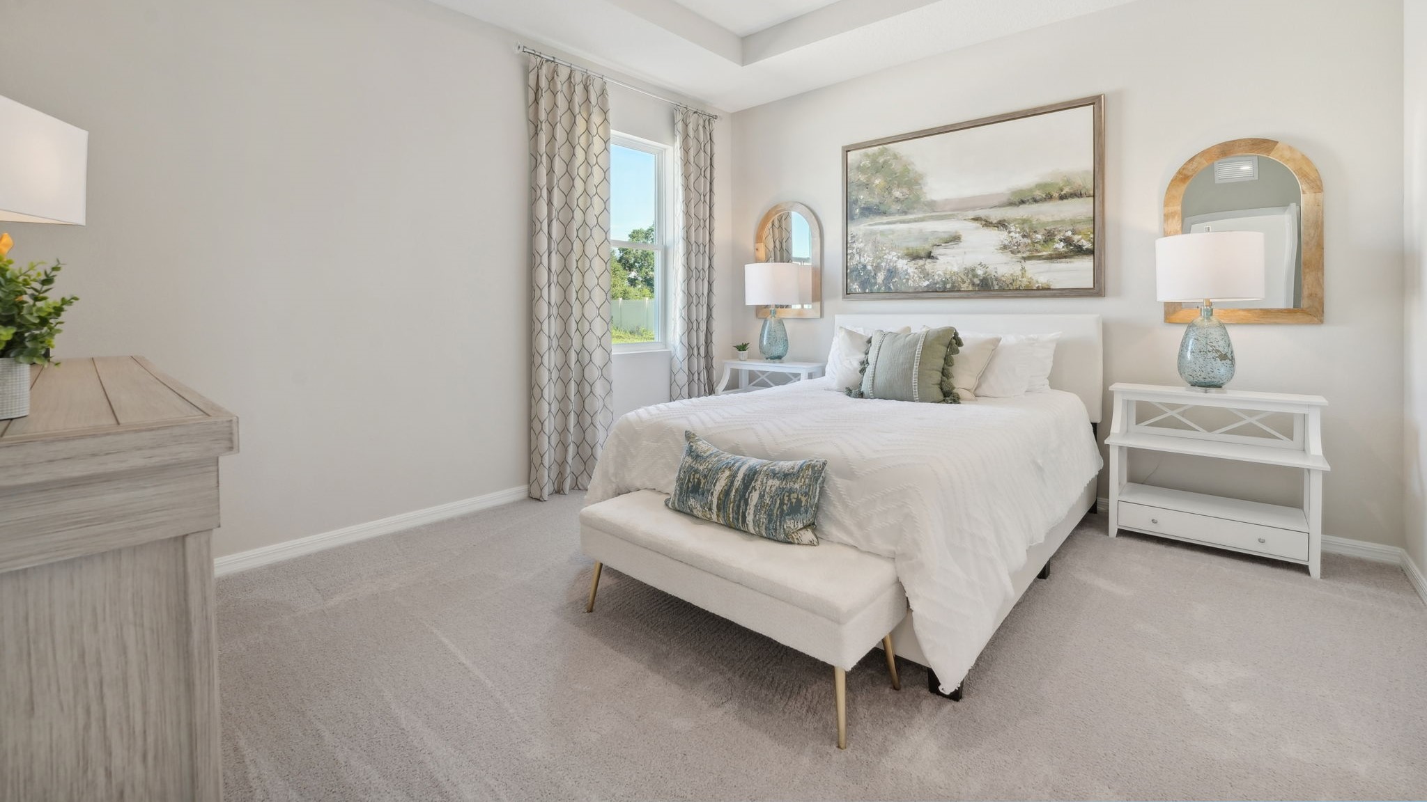 Guest bedroom with bed, nightstands, and a roomy closet for storage.