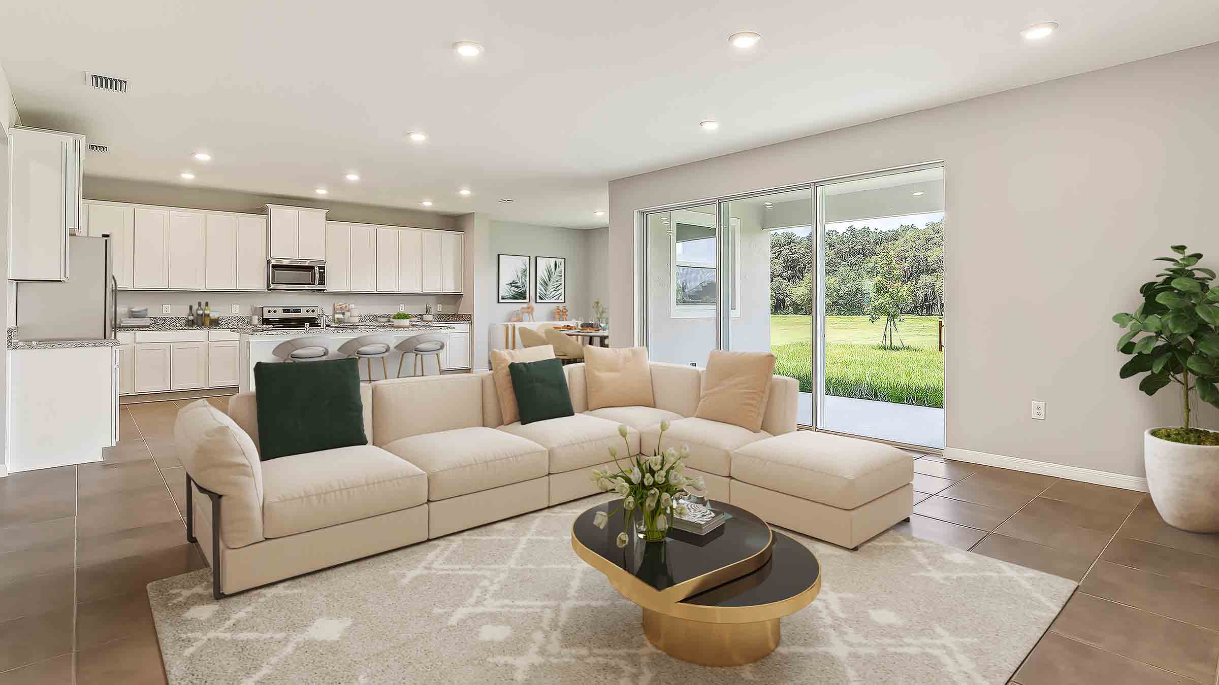 Open concept living area with couch seating and access to the backyard thru slider door.