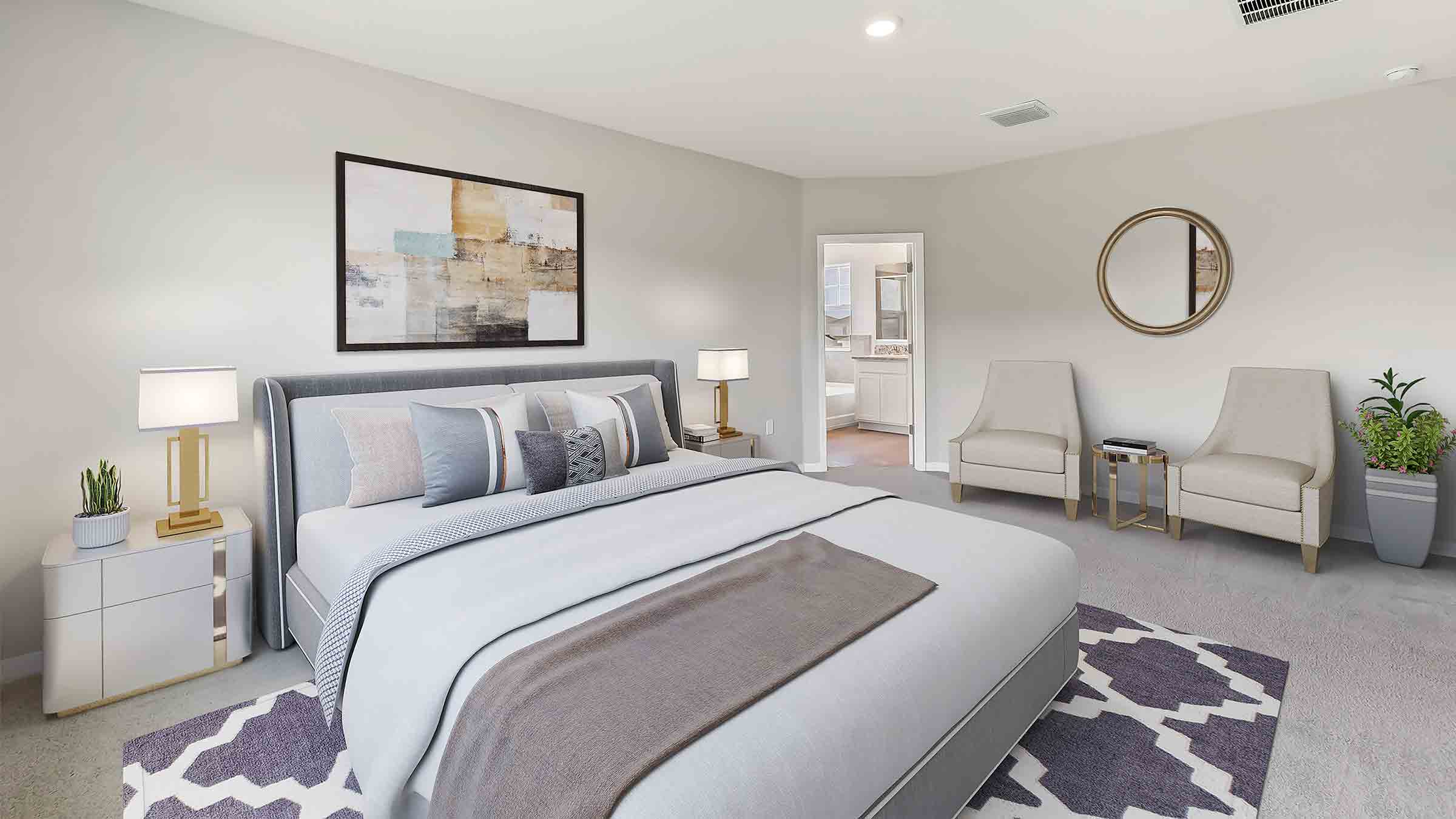 Spacious primary bedroom with king size bed, carpet flooring, natural lighting and a walk in closet.