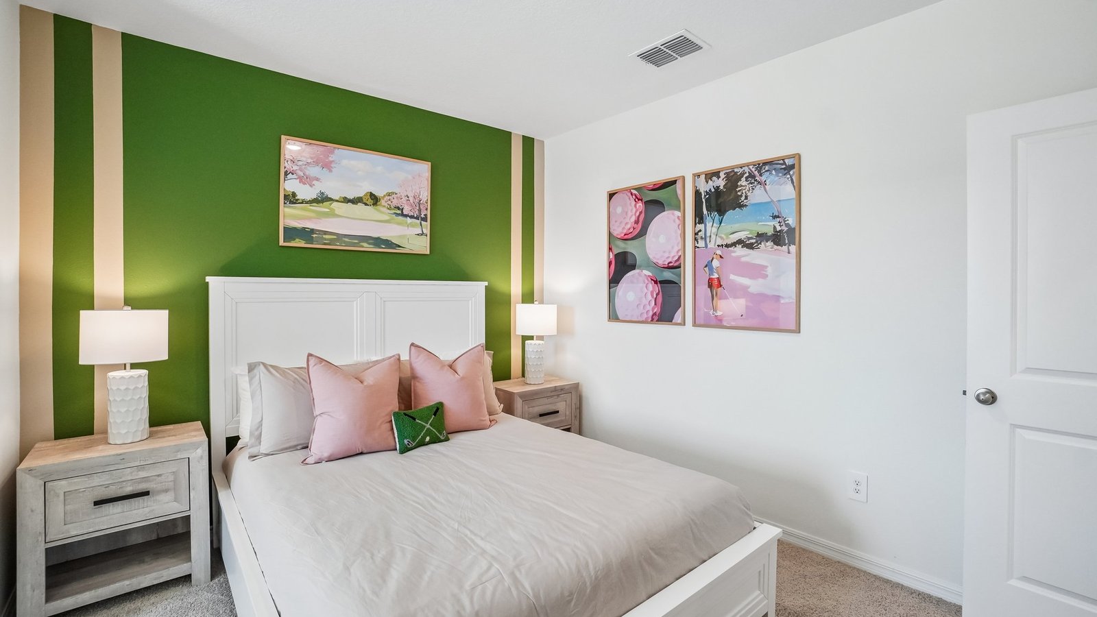 Guest bedroom with bed, nightstands and a roomy closet for storage.