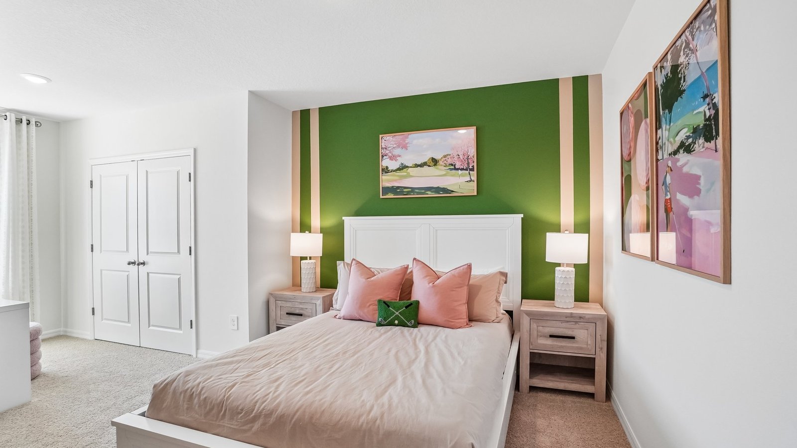 Guest bedroom with bed, nightstands and a roomy closet for storage.