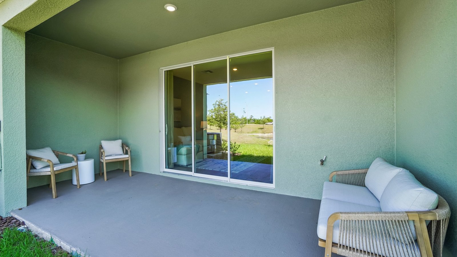Home backyard with covered lanai, and room for entertaining.