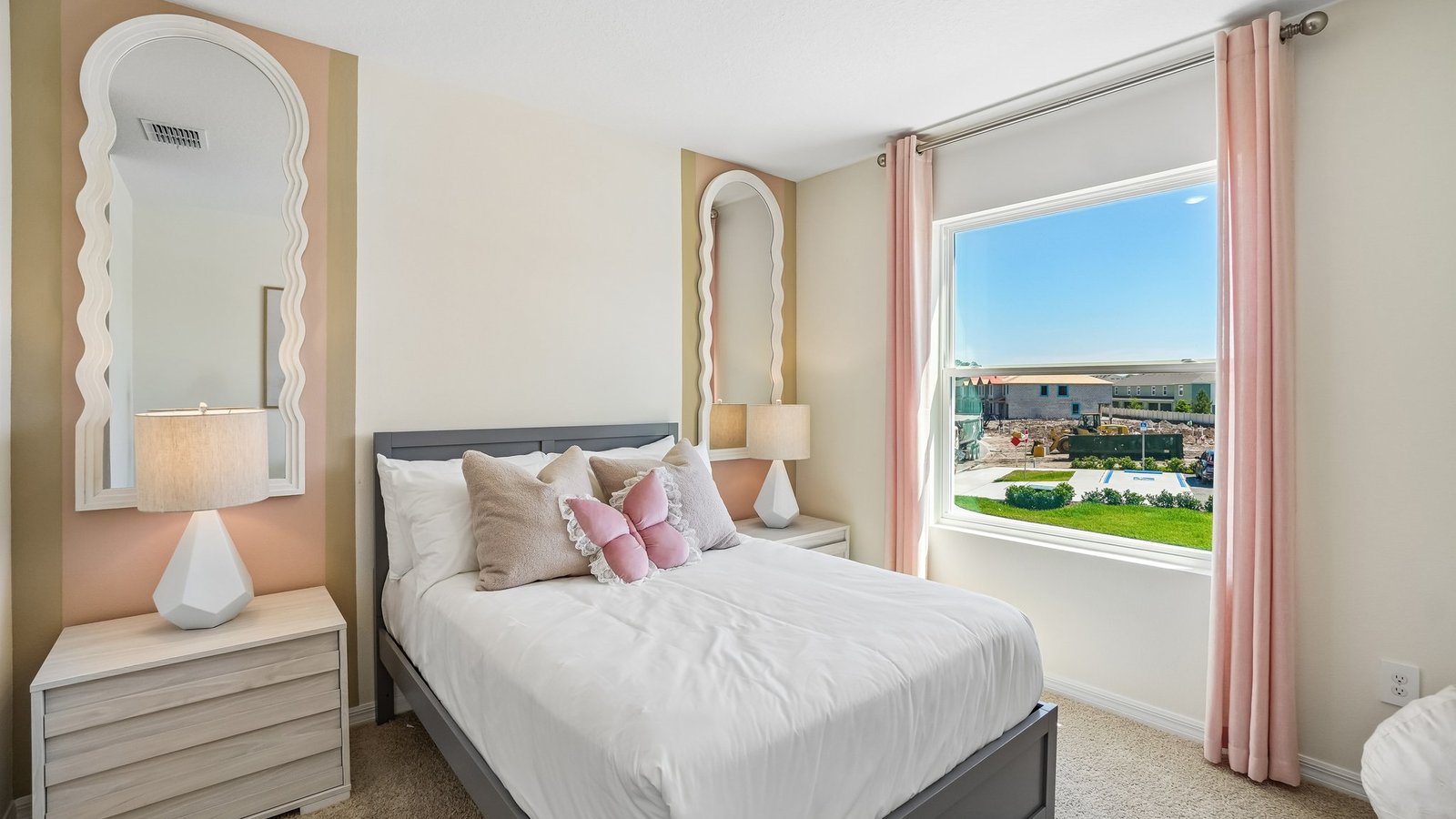 Guest bedroom with bed, nightstands and a roomy closet for storage.
