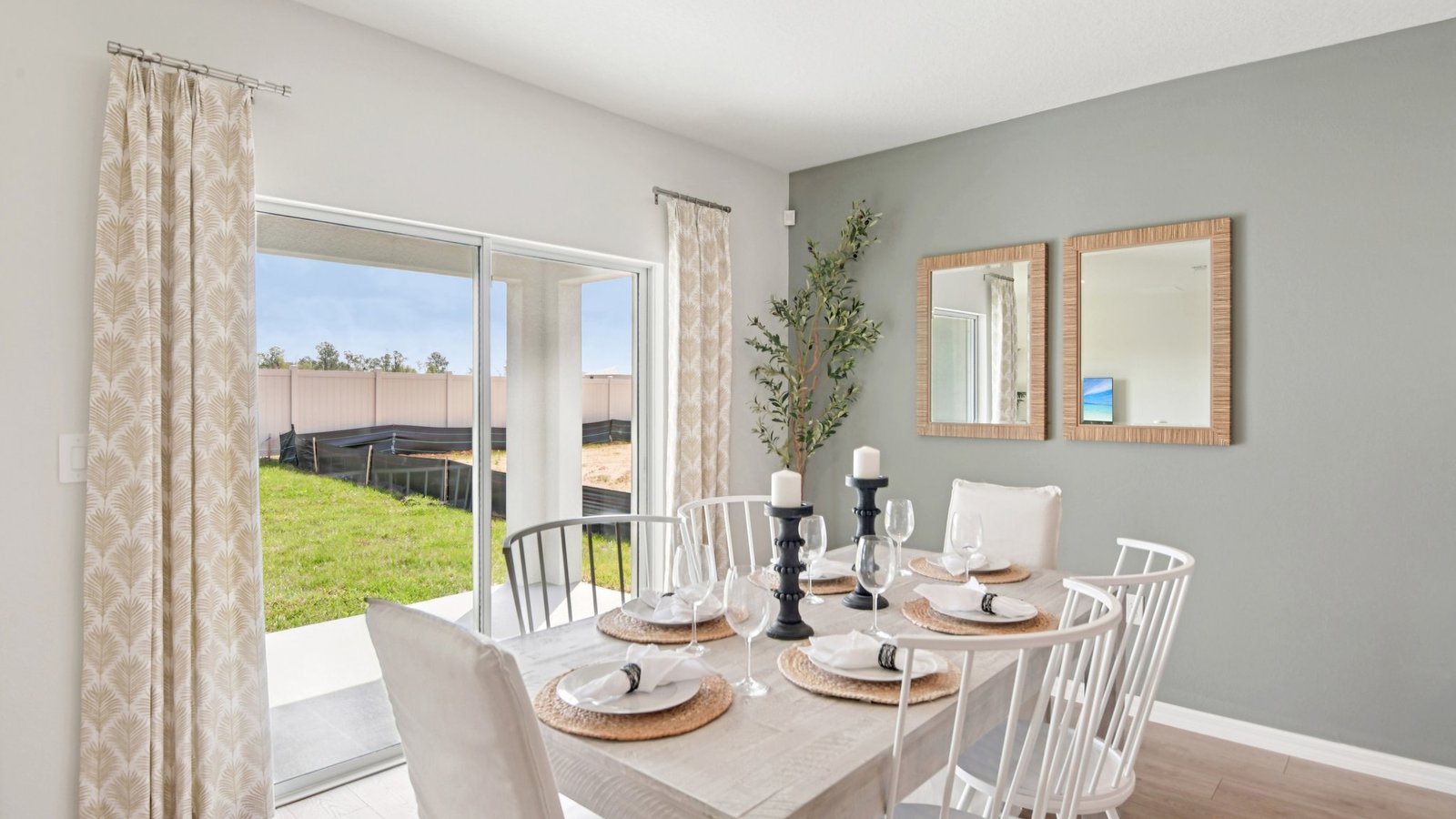 Dining room adjacent to the kitchen with table, chairs and LVP flooring.