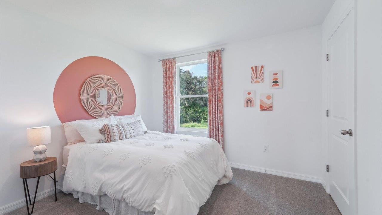 Guest bedroom with bed, nightstands, and a roomy closet for storage.