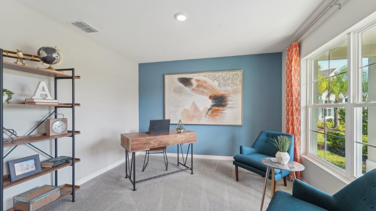 Functional home office with desk, chairs and space to work or play.