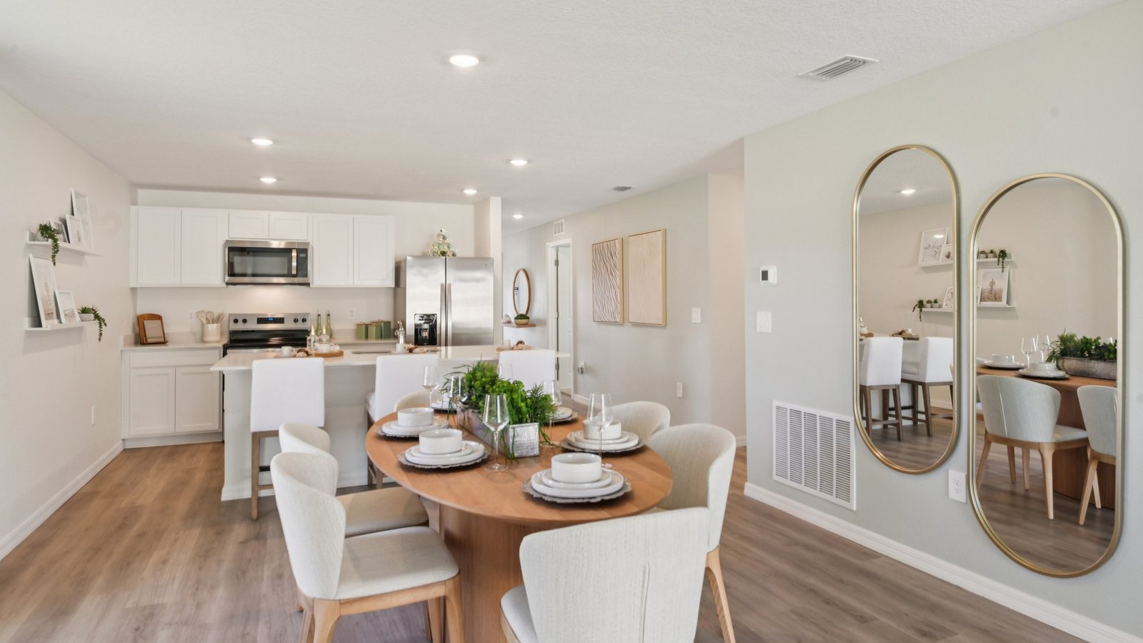 Dining room adjacent to the kitchen with table, chairs and LVP flooring.