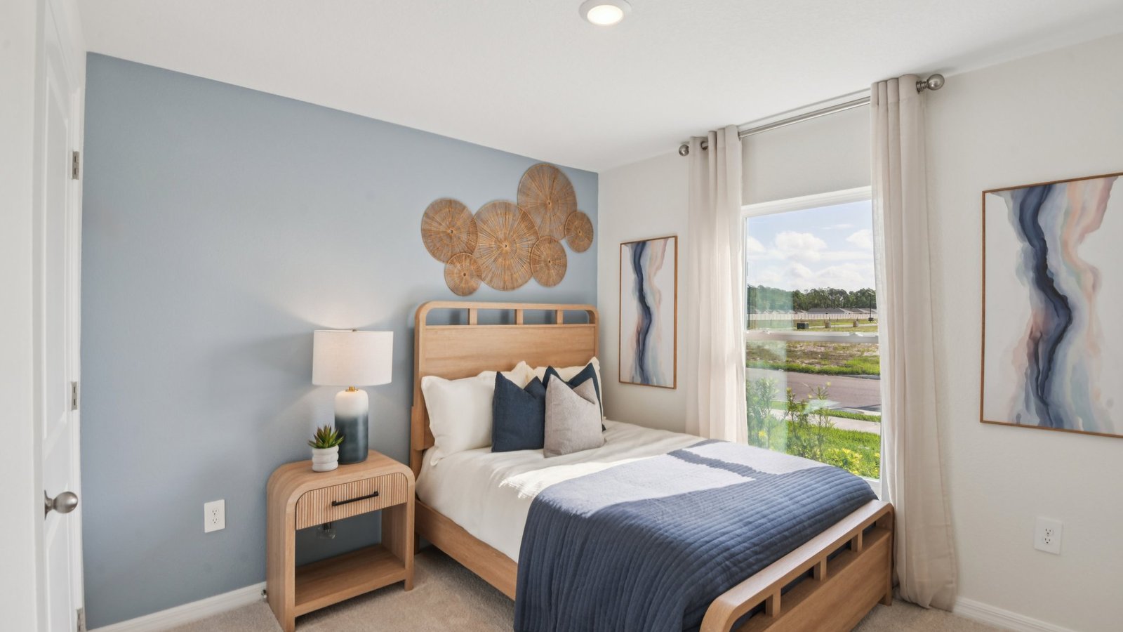 Guest bedroom with bed, nightstands and a roomy closet for storage.