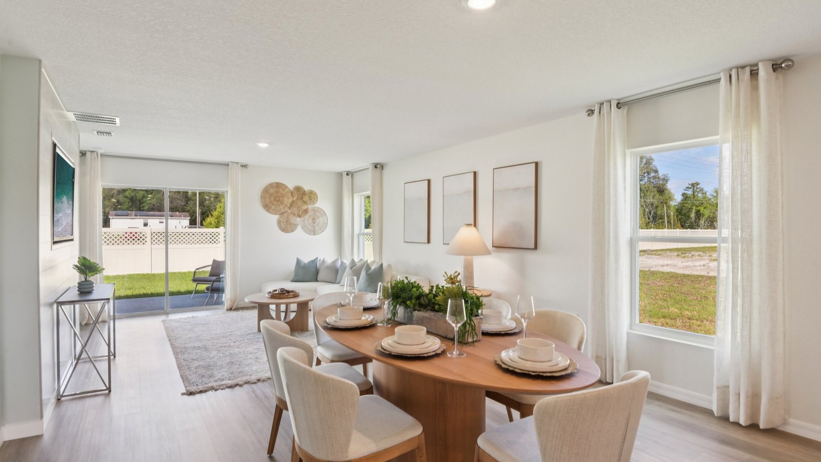 Dining room adjacent to the kitchen with table, chairs and LVP flooring.