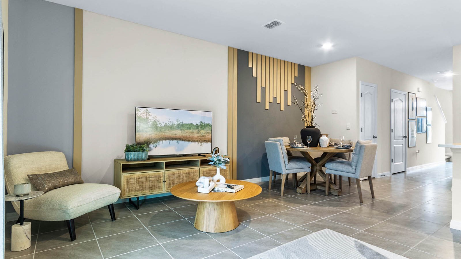 Dining room adjacent to the kitchen with table, chairs and tile flooring.